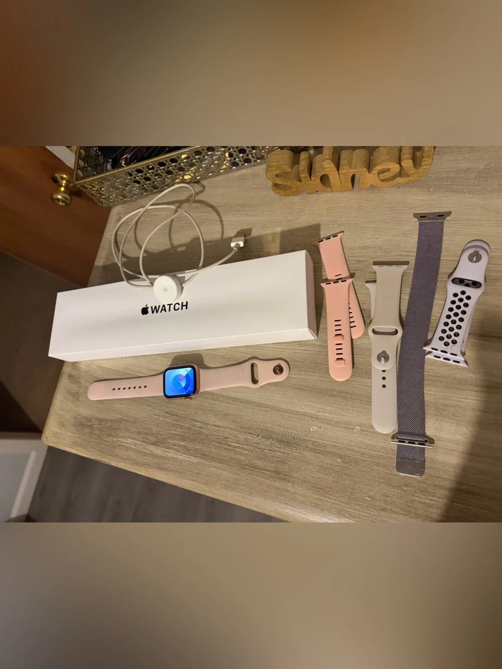 Apple Watch with Pink Sport Band and Multiple Additional Bands